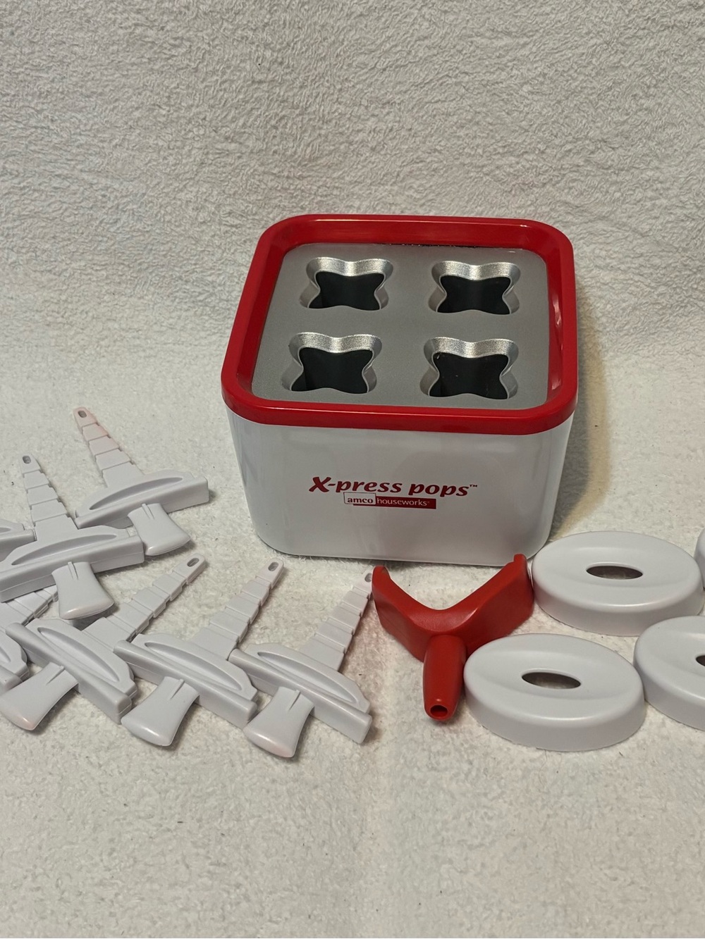 X-press Pops Ice Pop Maker create frozen treats in just 10 minutes - Red & White